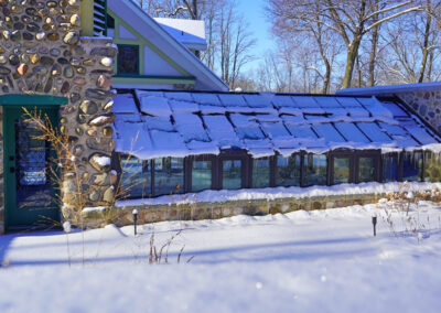 First snow covers greenhouse