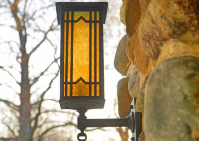 Outside sconces in field stone columns