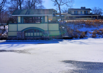 Boathouse and main house from frozen shoreline